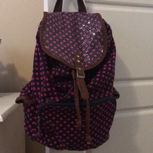 Navy blue polka dot backpack